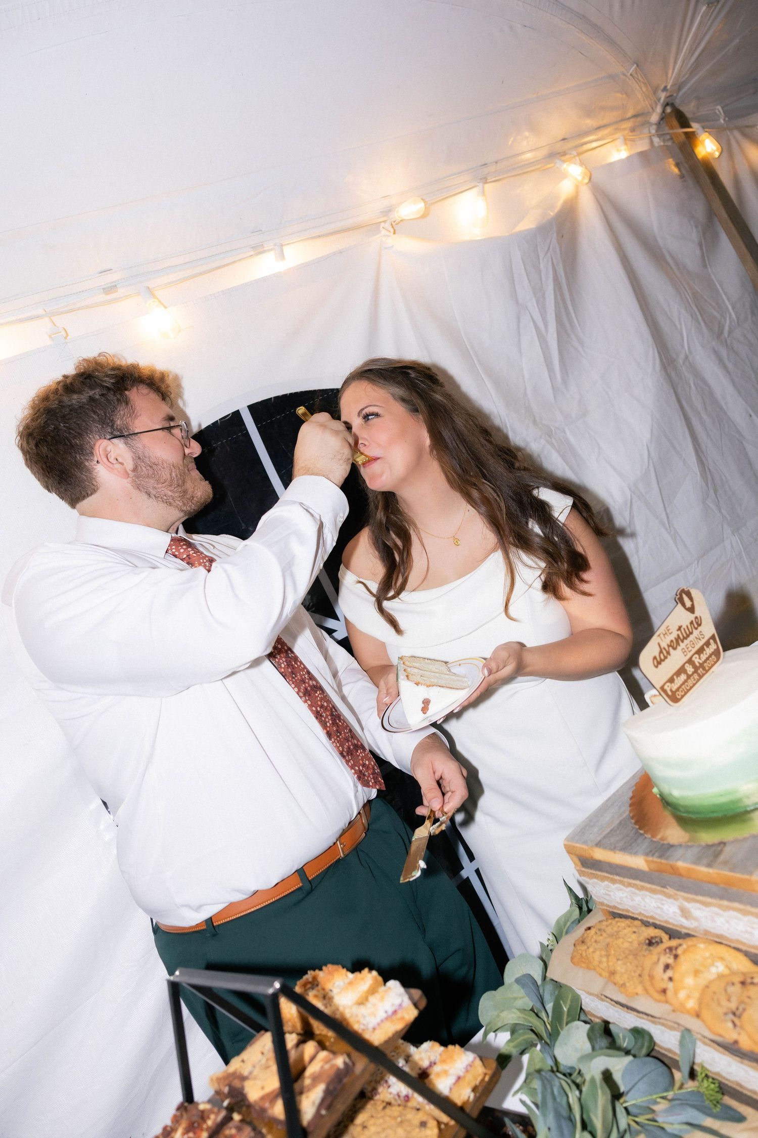 Bride and groom cake cutting reception photos in a tent in Springfield, Illinois