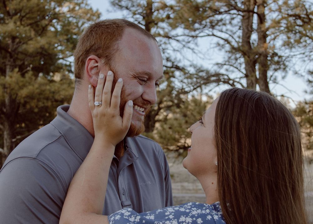 A couple shares romantic moments in a series of outdoor photos against a natural backdrop.