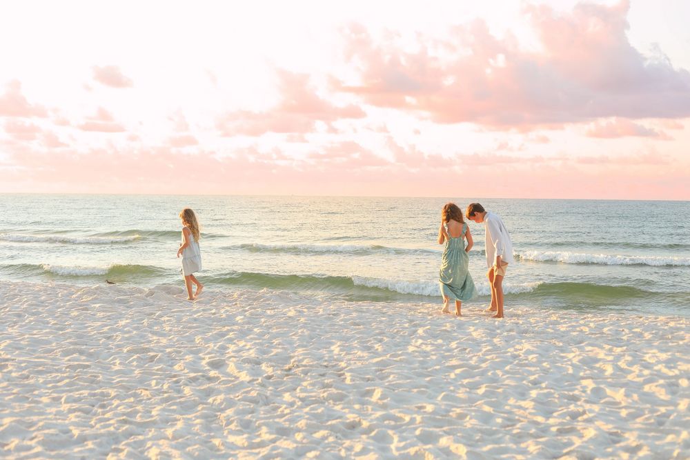 Siblings exploring the beach photographed by Danielle Denise Photography.
