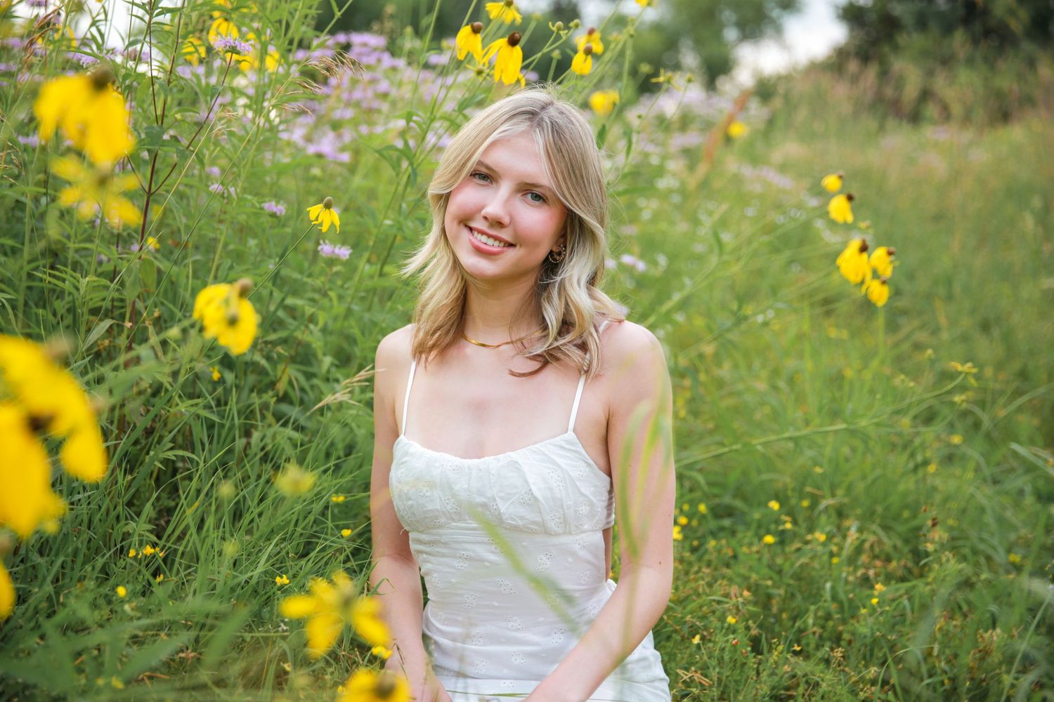 Senior photos in Springfield, Missouri in a field