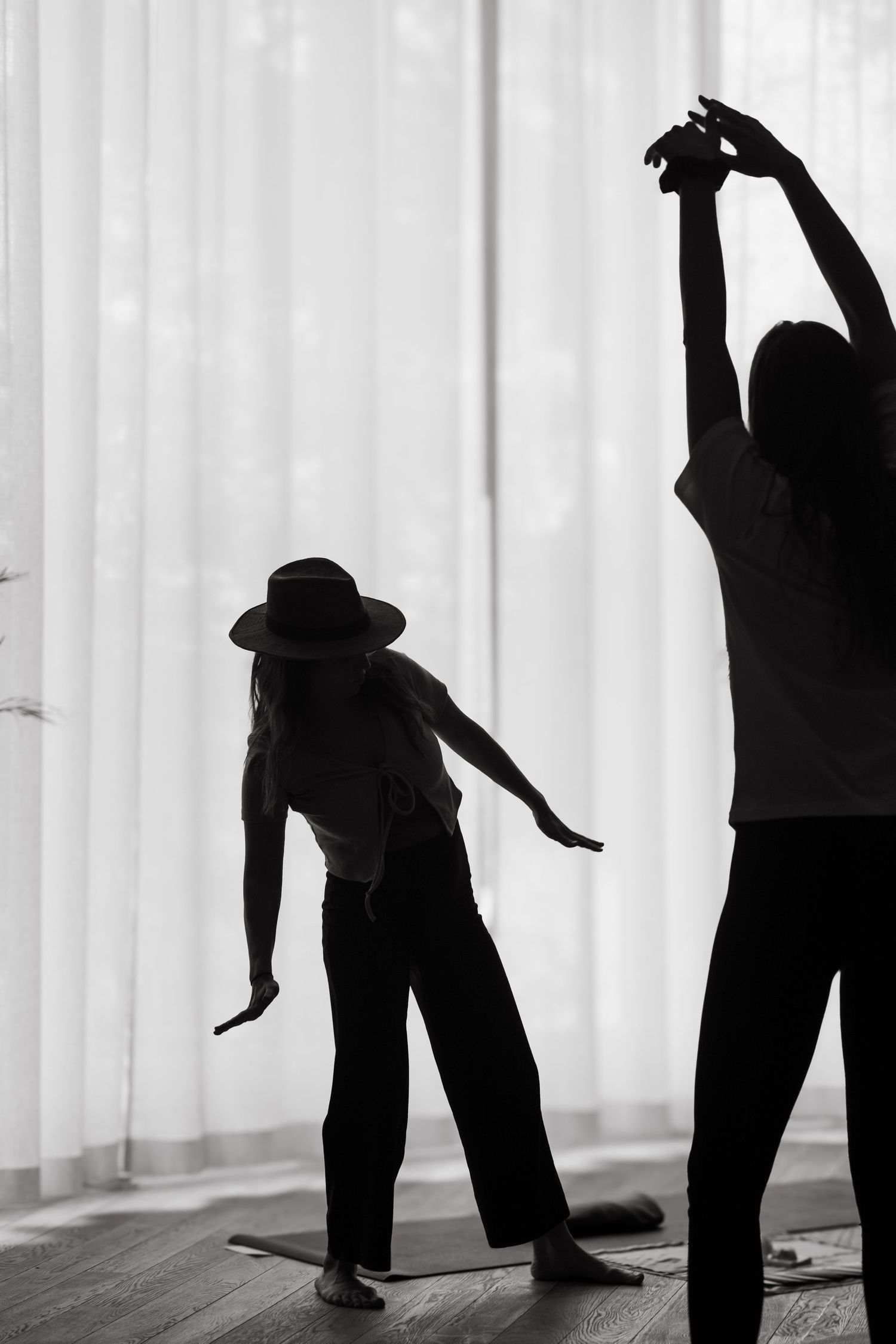 a woman dancing in a yoga studio during yoga retreat while being captured by stockholm photographer