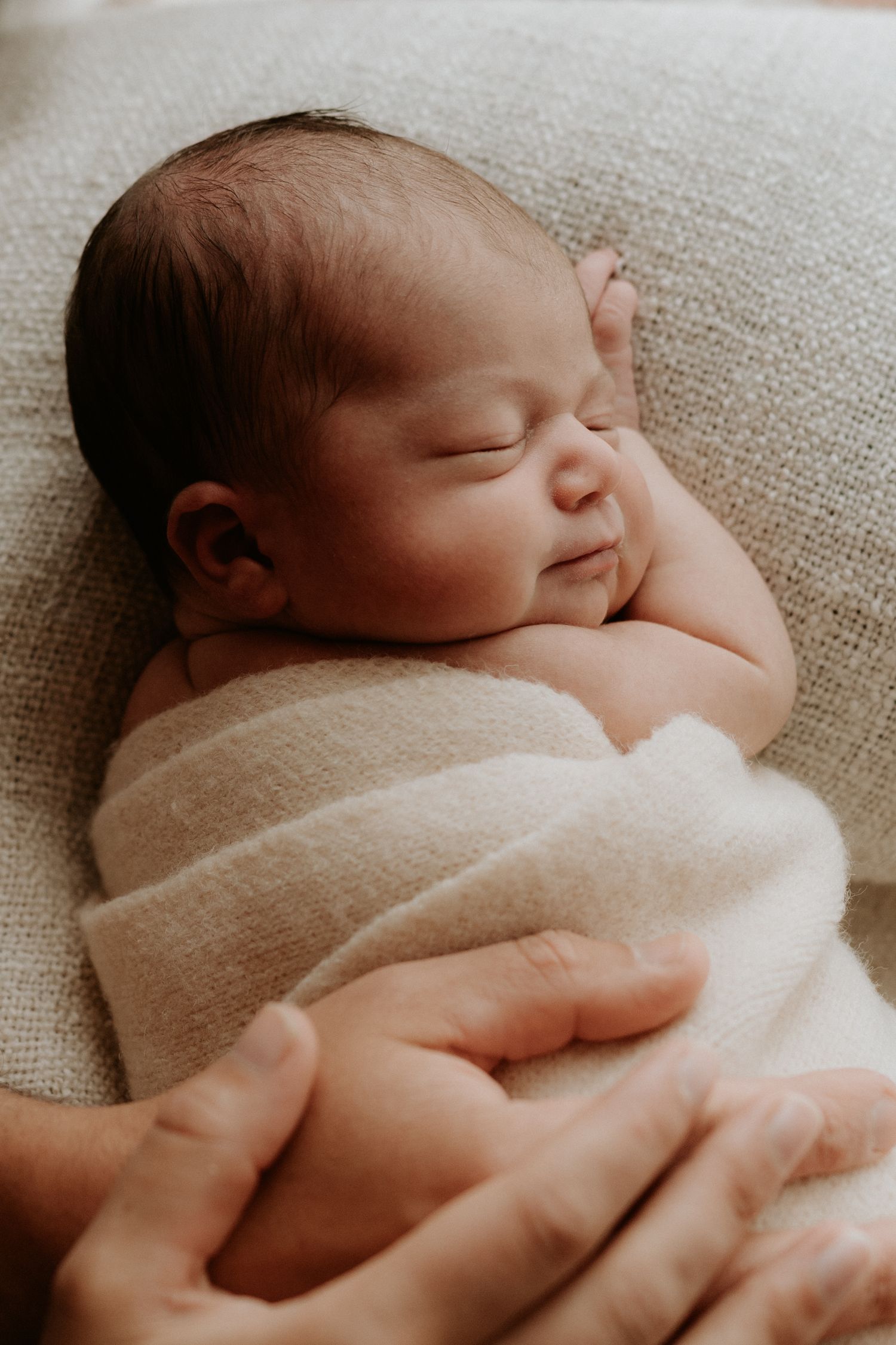 A natural professional photo of a newborn baby at home