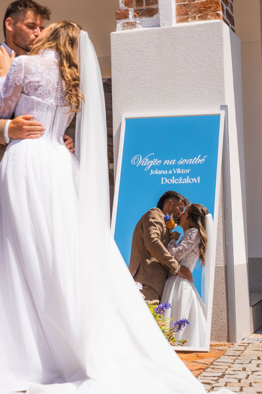 photo of just married couple in a mirror