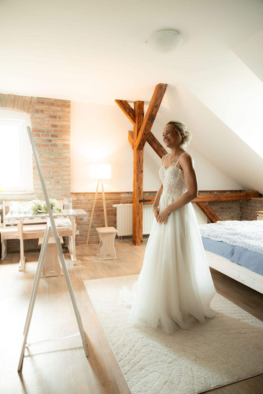 bride looking at herself in a mirror