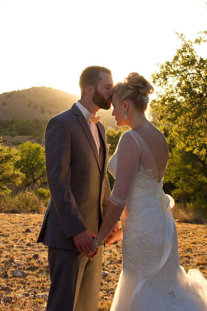 A bride and groom share an intimate moment at sunset in a desert mountain setting.
Wedding photography