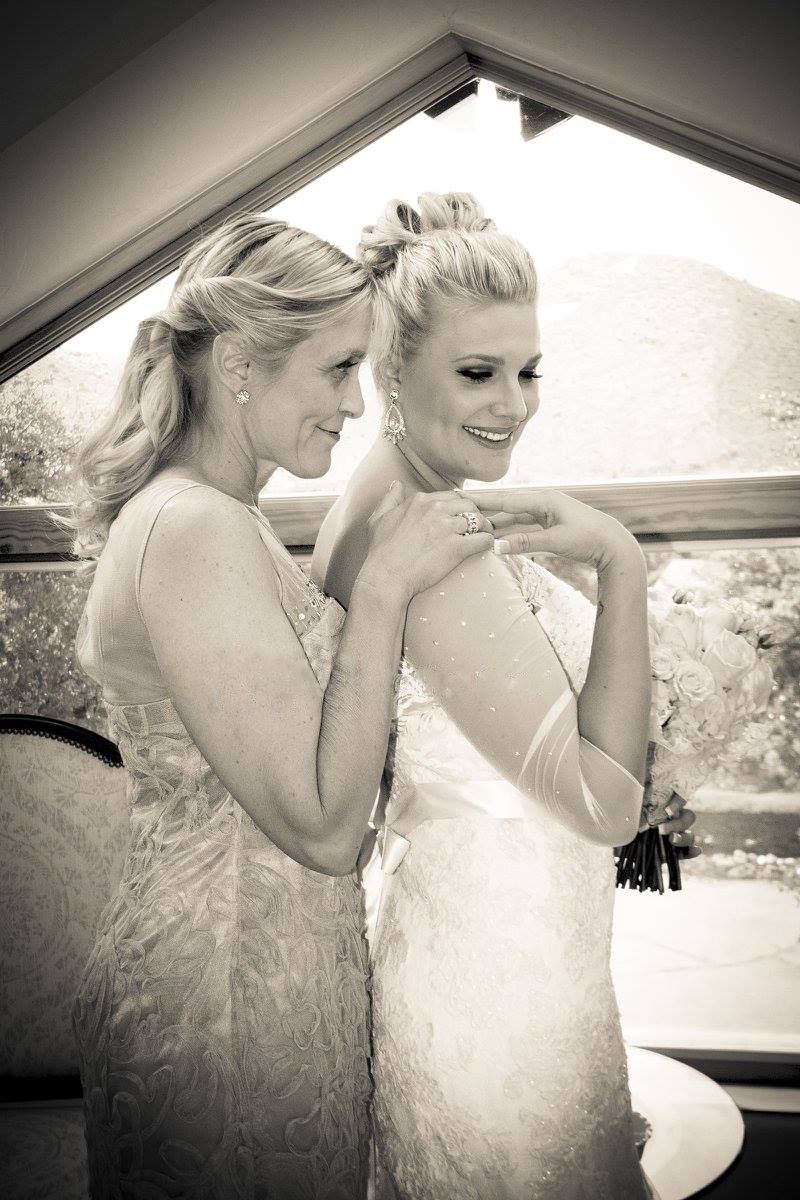 Black and white candid moment of wedding preparation with elegant dresses.
Wedding photography
mother daughter