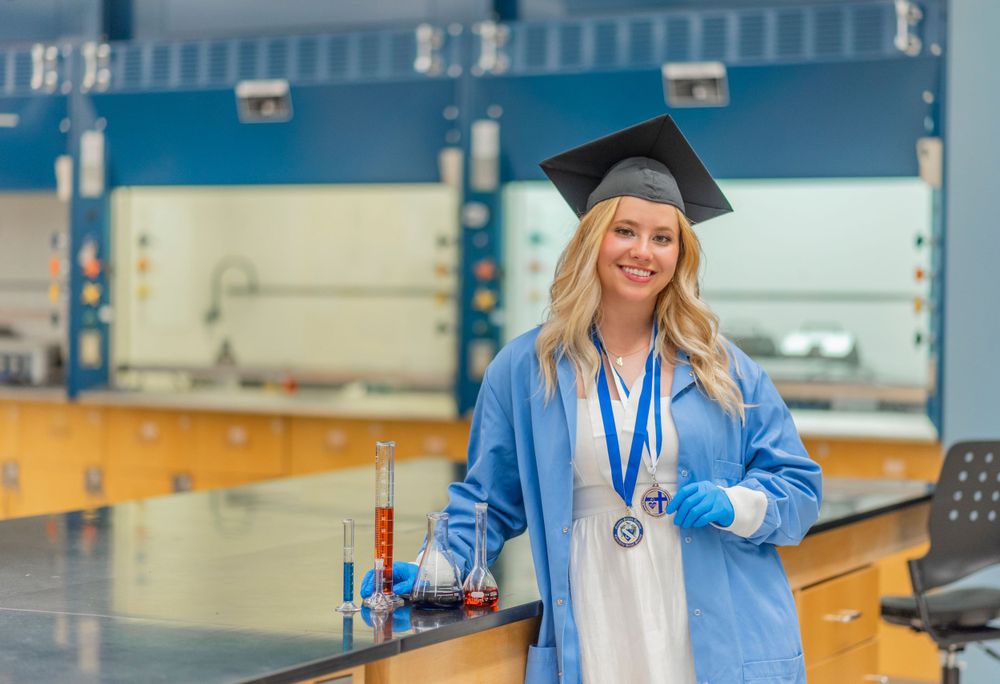 girl grad photo in science lab
