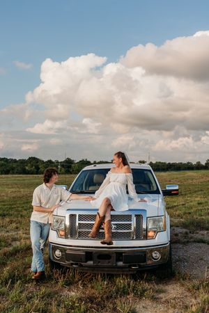 Engagement photos in an open field with white truck. Cincinnati Wedding photographer. NKY wedding photographer. Chicago Wedding.