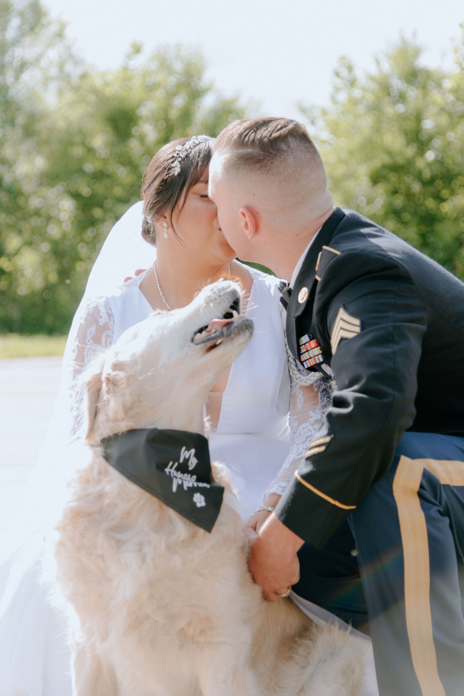 Joyful couple sharing an intimate moment outdoors during a wedding photoshoot.