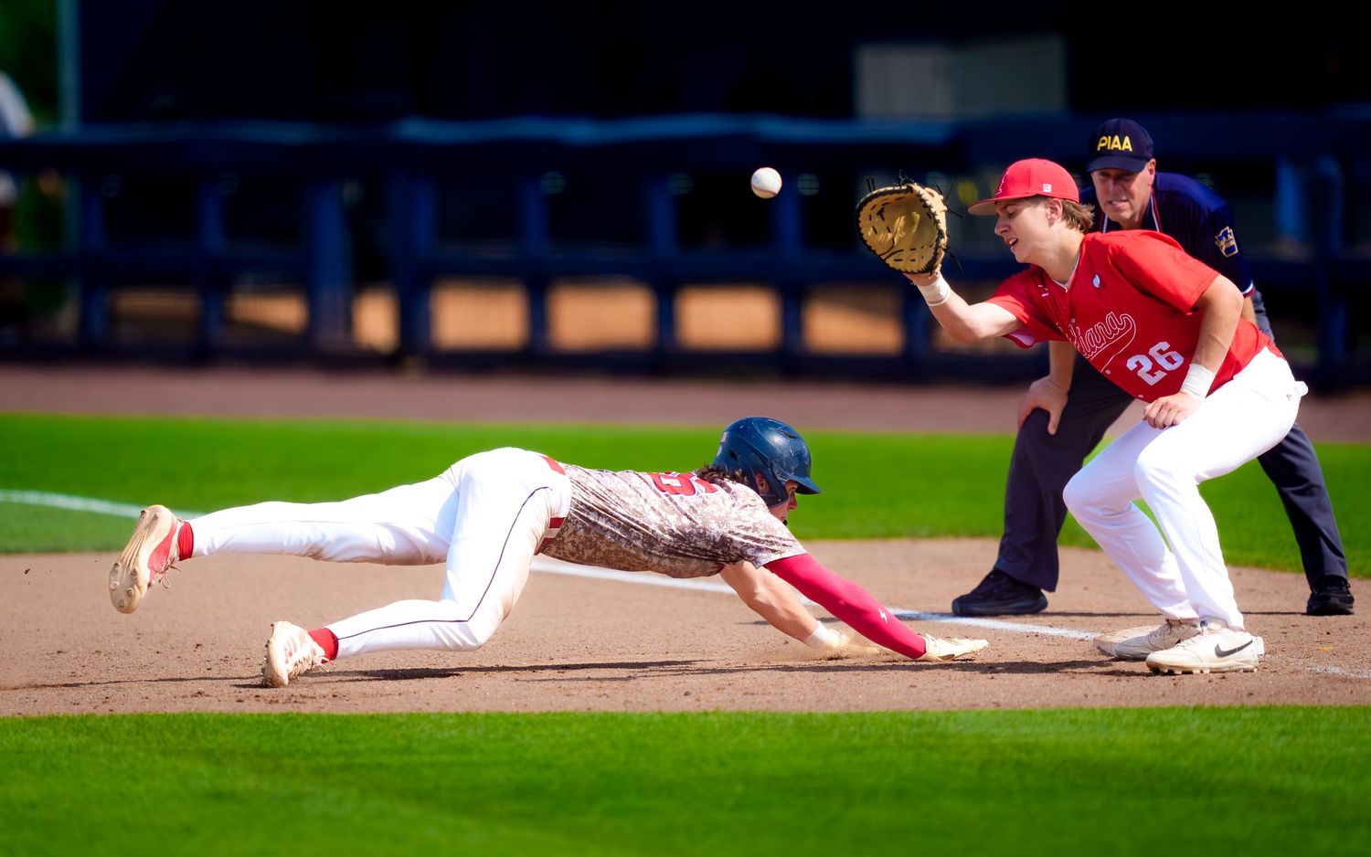Baserunner diving back to base during PIAA Class 4A State Baseball Championship, by Deanna Fox, SportsFox Photography, Hershey PA