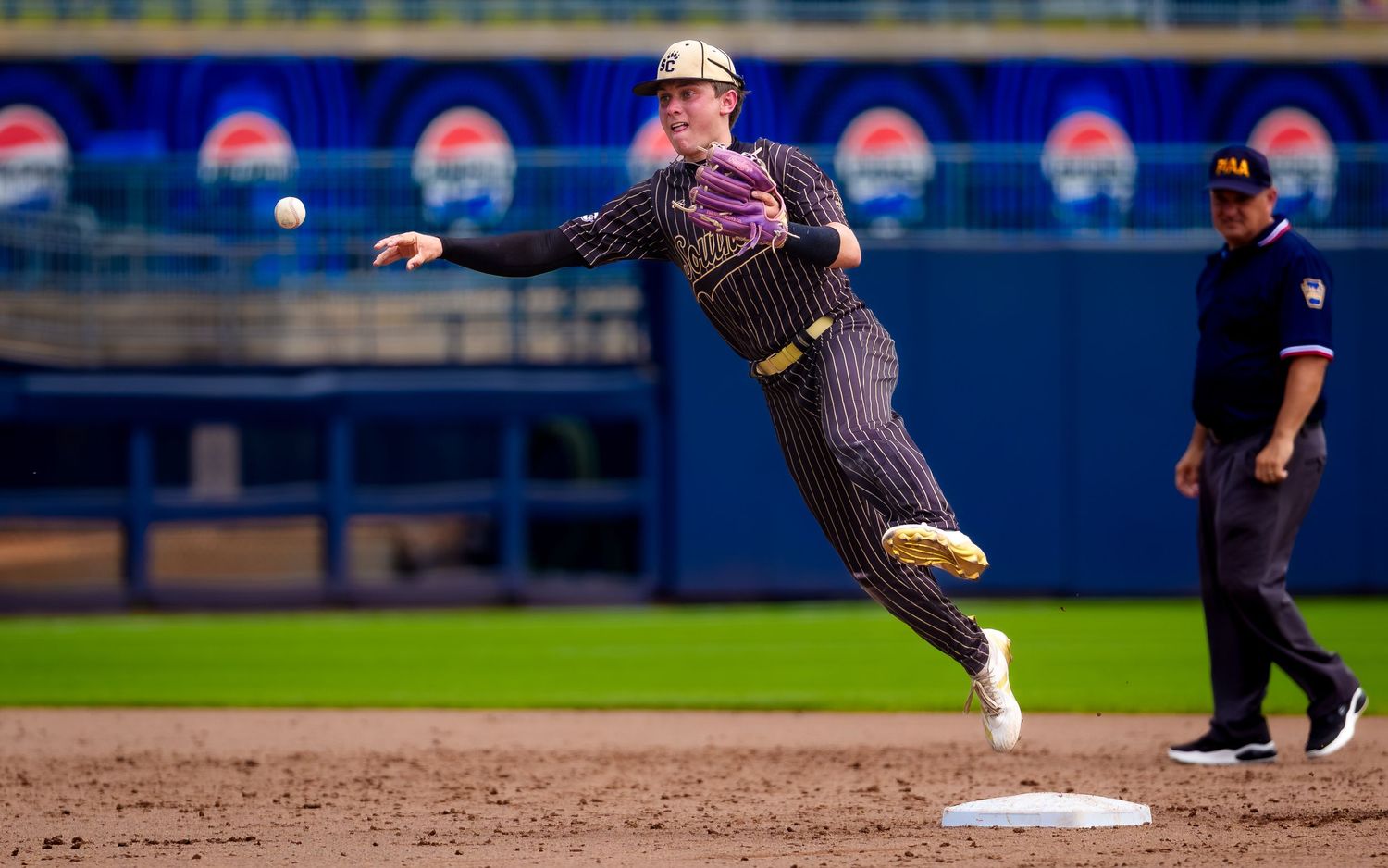 Infielder leaping for catch during PIAA Class 1A State Baseball Championship, by Deanna Fox, SportsFox Photography, Hershey PA
