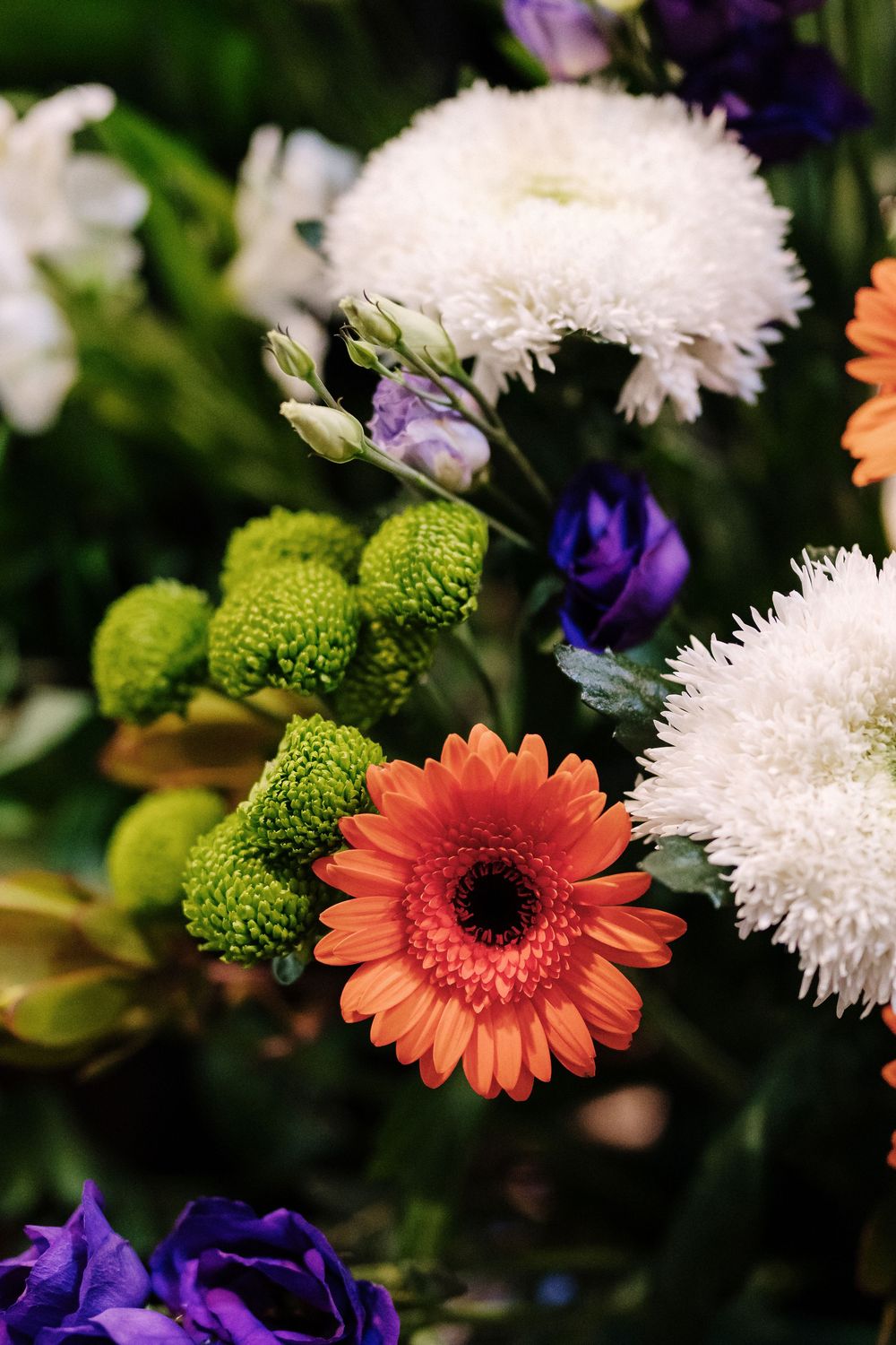 Colorful bouquet featuring orange gerbera daisy, St Mary Redcliffe Church, Bristol Wedding