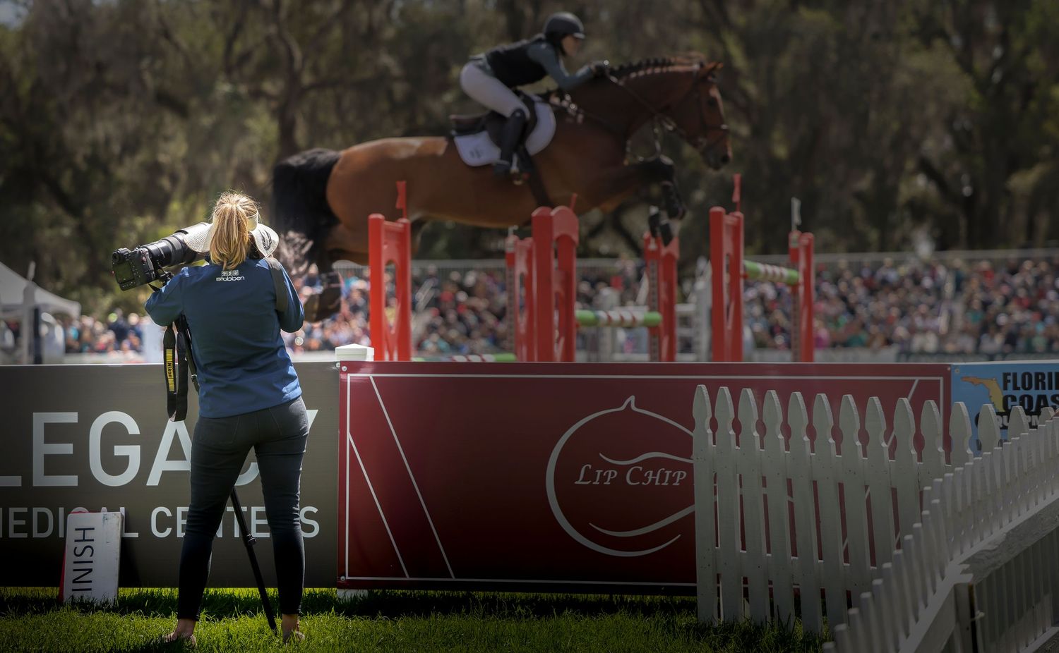 Erin Gilmore photographing an equestrian event.