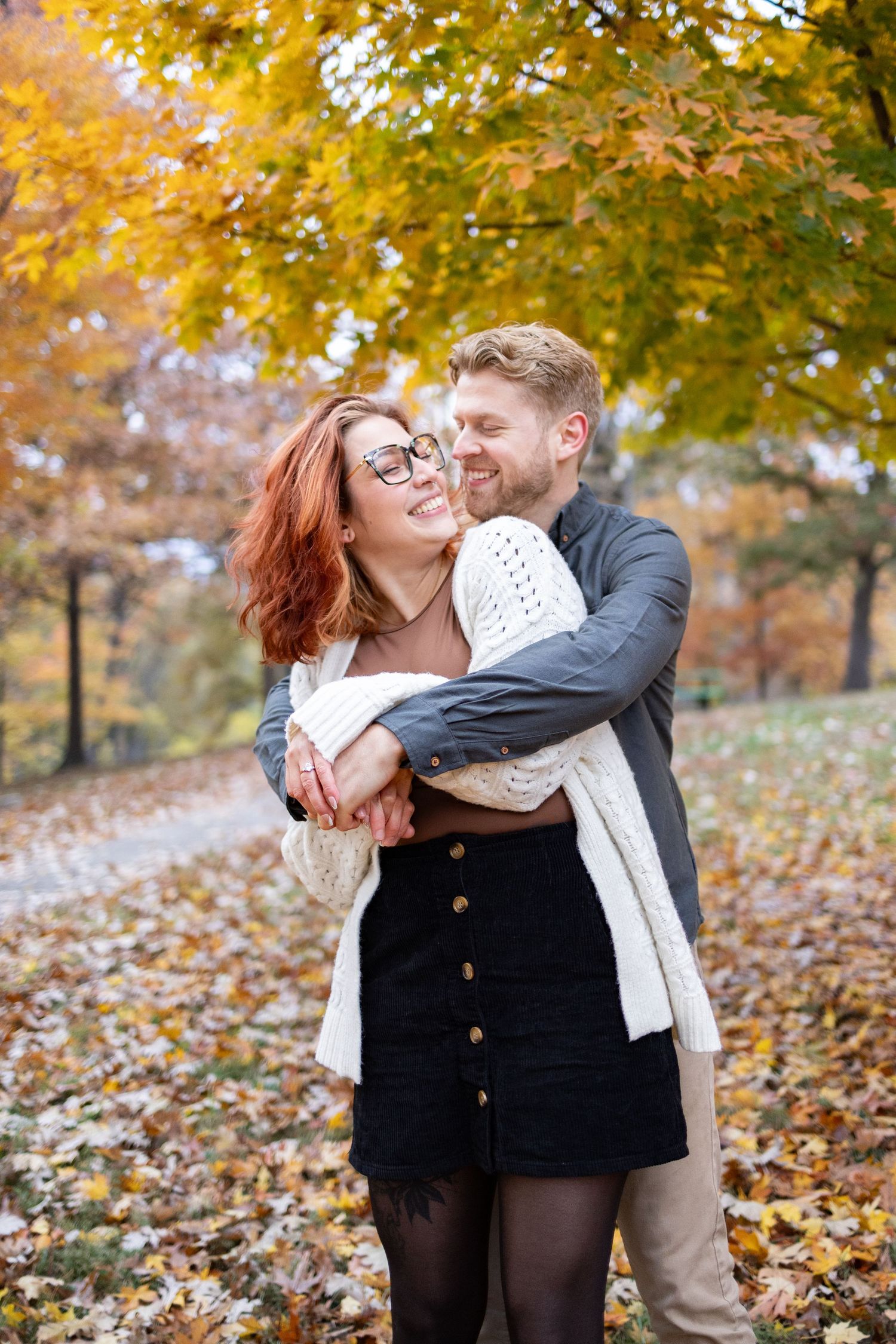 Engaged couple during their fall engagement photoshoot in Eden Park in Cincinnati.