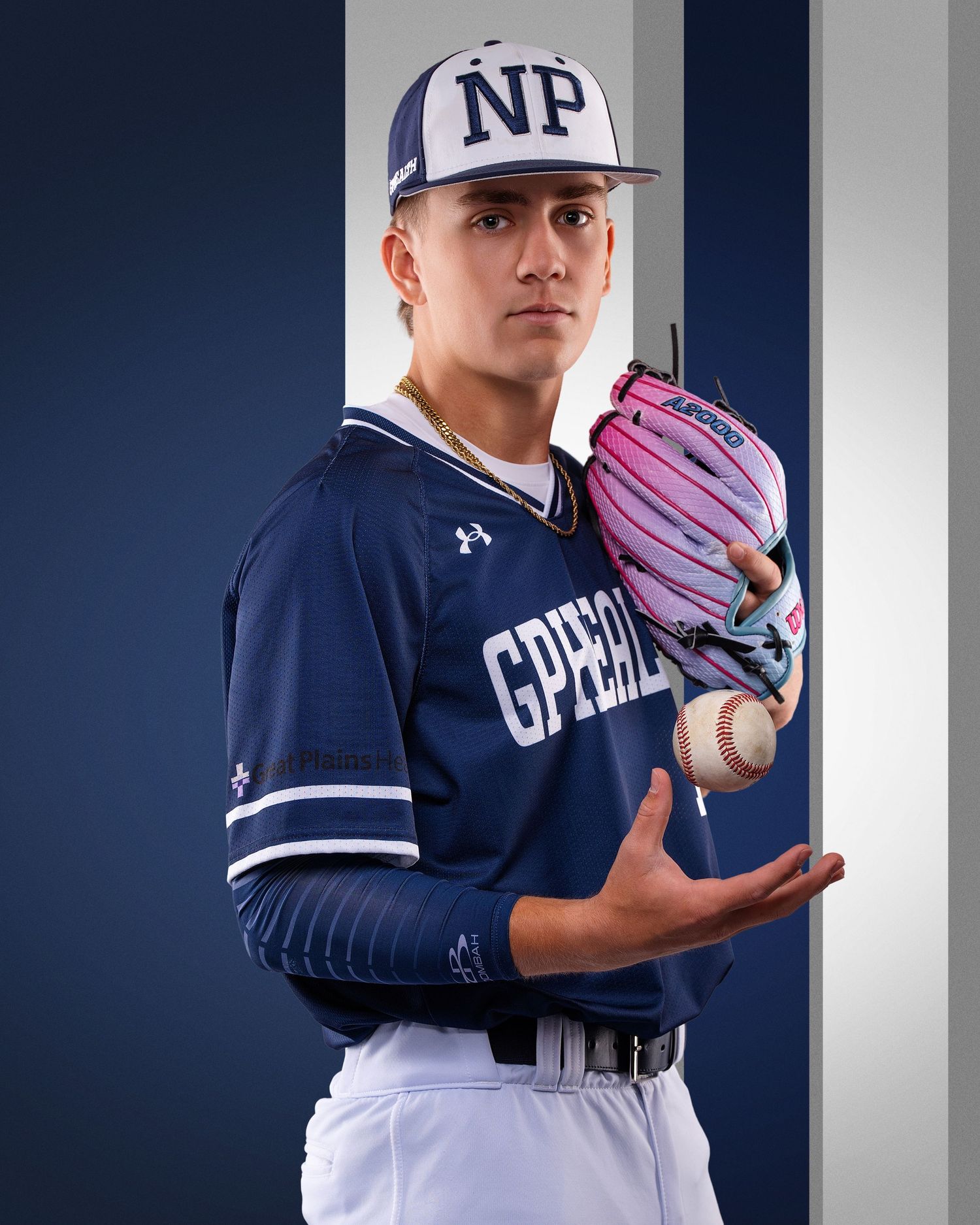 Baseball player in NP navy uniform holds pink glove and ball, posing for team portrait photo.