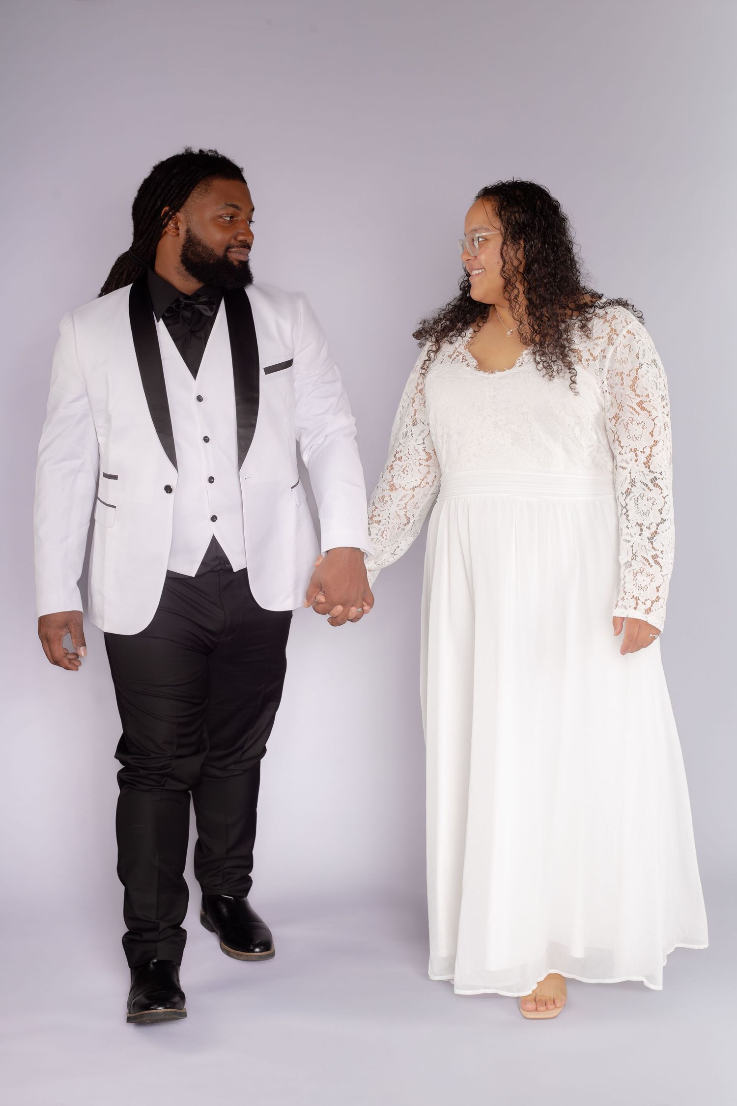 studio wedding portraits couple looking at each other