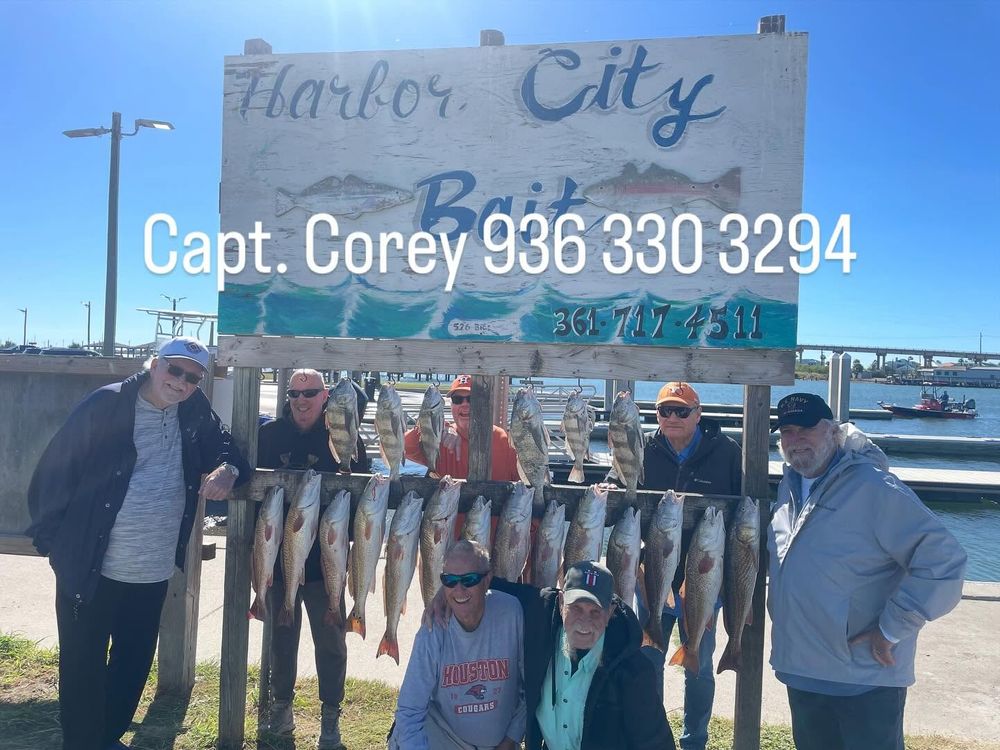 Group of anglers displaying impressive redfish catch at Harbor City Bait with Capt. Corey.