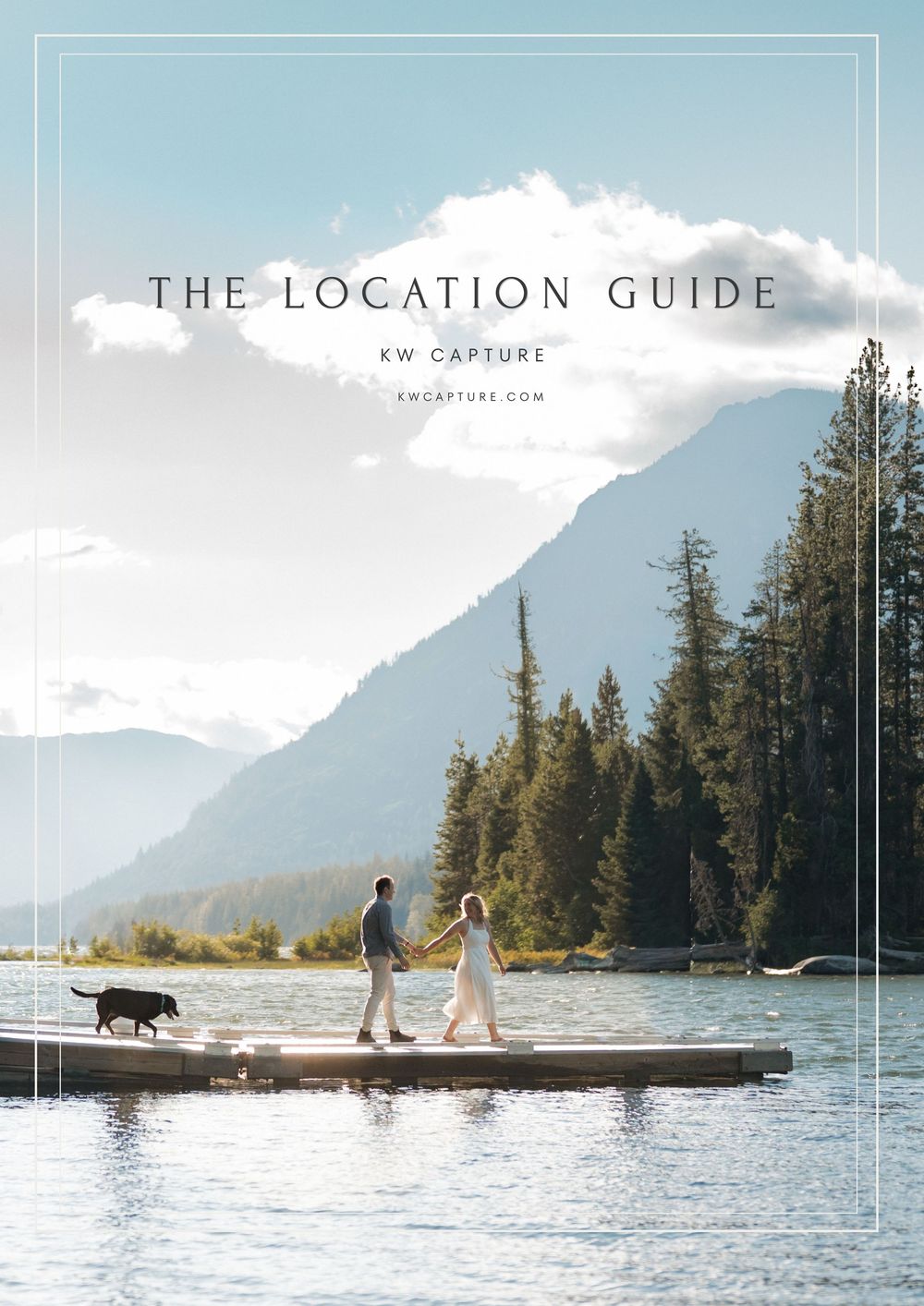 Couple walking their dog on a lakeside dock with mountain and forest backdrop, featured in KW Capture Location Guide.