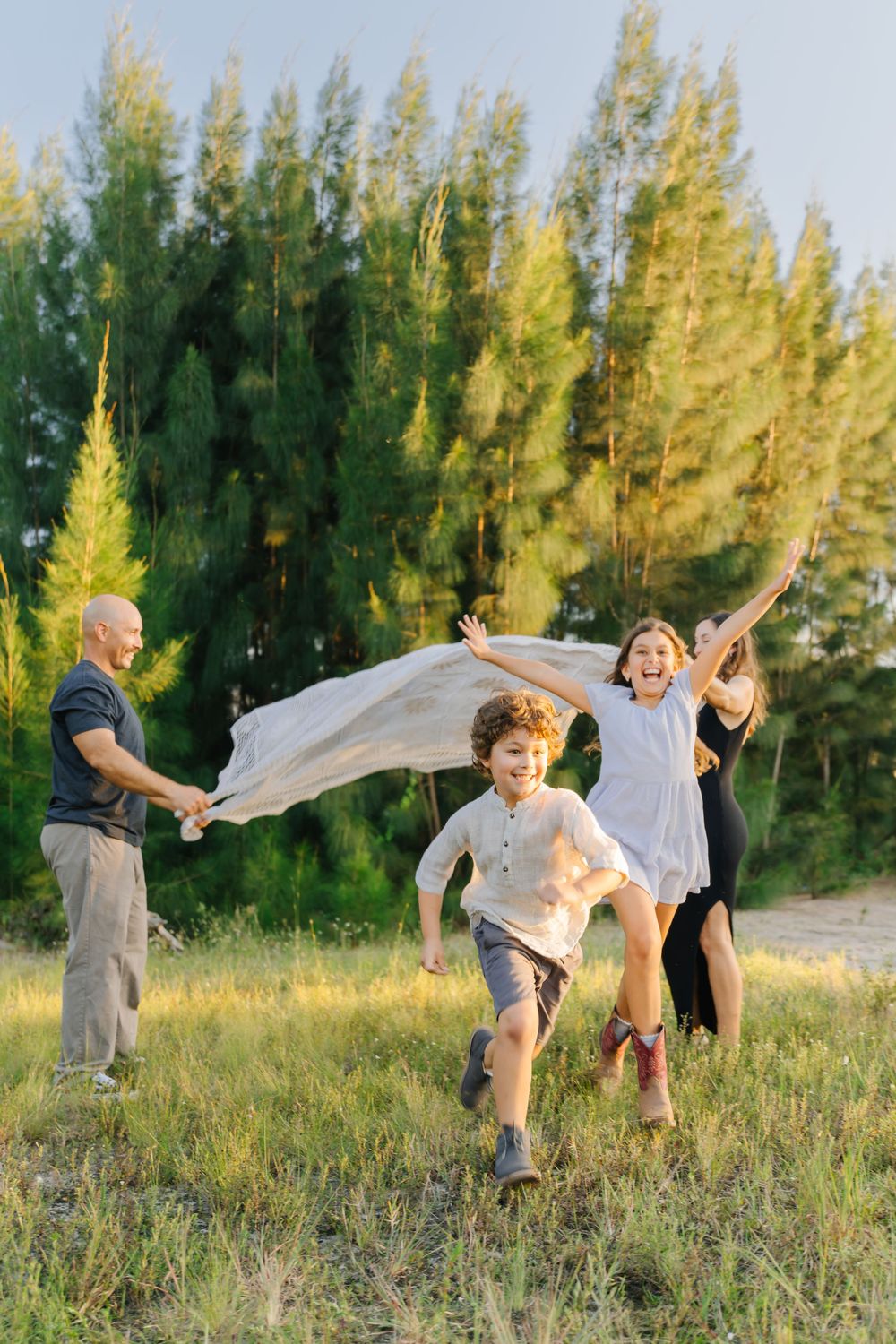 Family playing at sunset during a Boynton Beach Florida family photography session