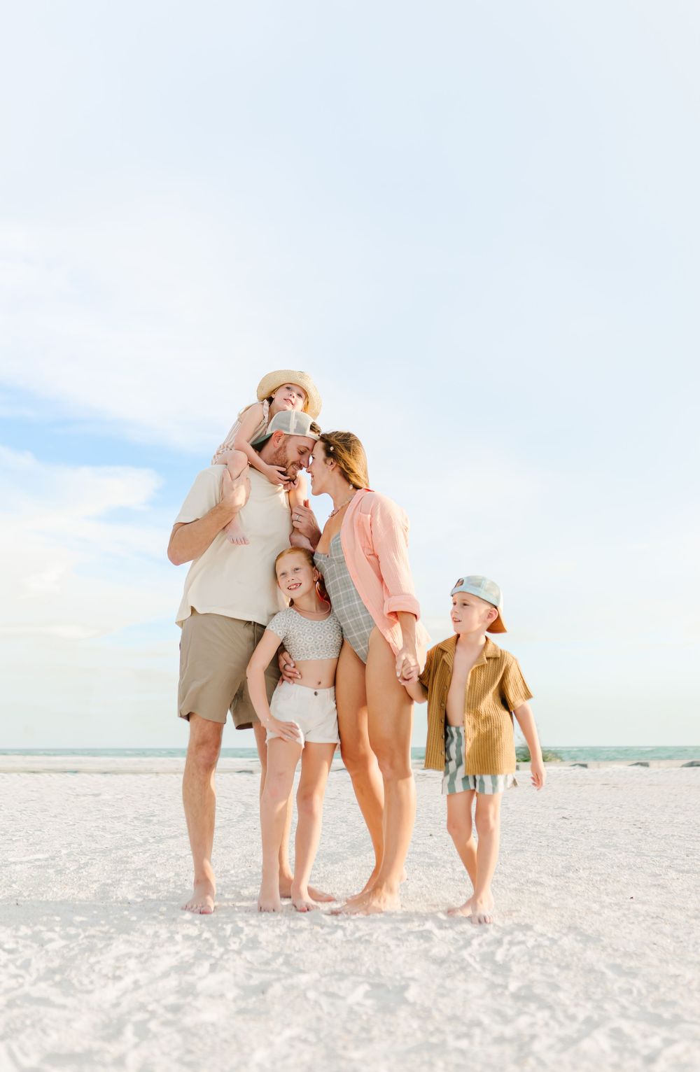 Family of five laughing together during a South Florida family photography session