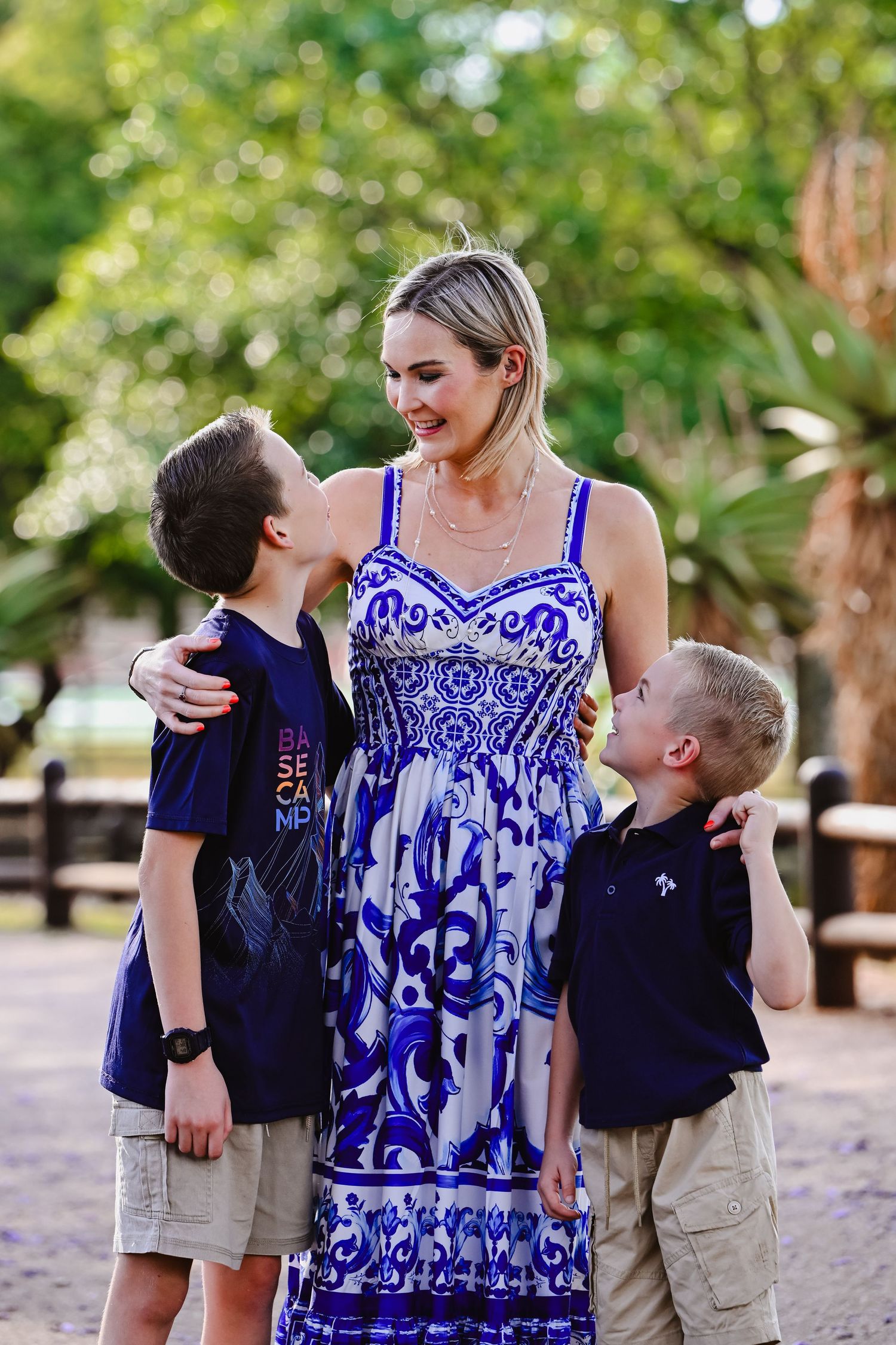 Mother and sons portrait during Jacaranda season in Pretoria, photographed by Rynali Photography.