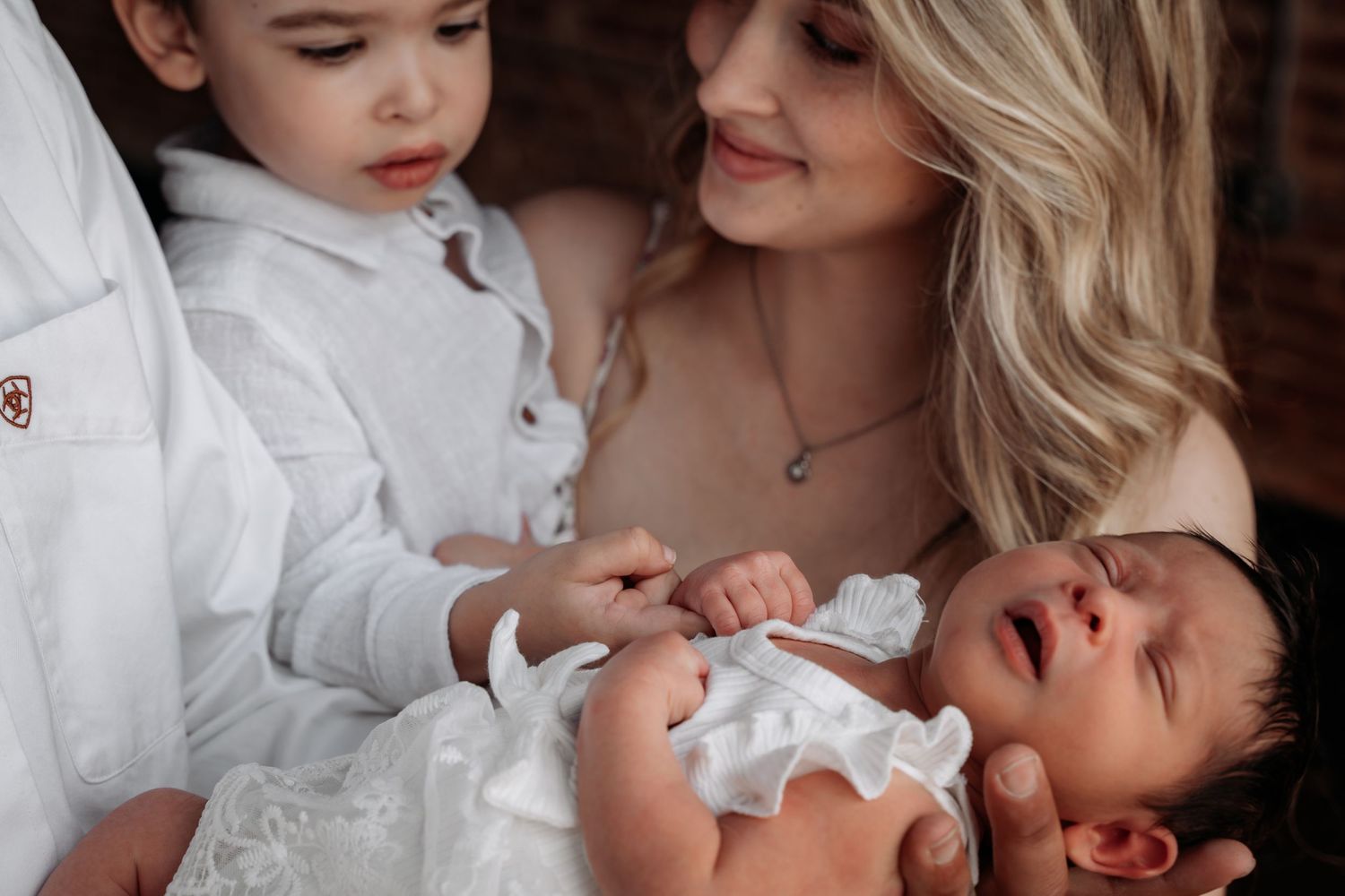 Mother holding baby newborn during a natural newborn photography session in Humboldt, West , Tennessee. Jackson, TN