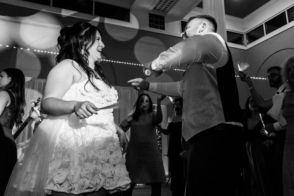 Channel Side Club in Palm Coast Florida. Wedding photography of fun wedding reception. People dancing at party.