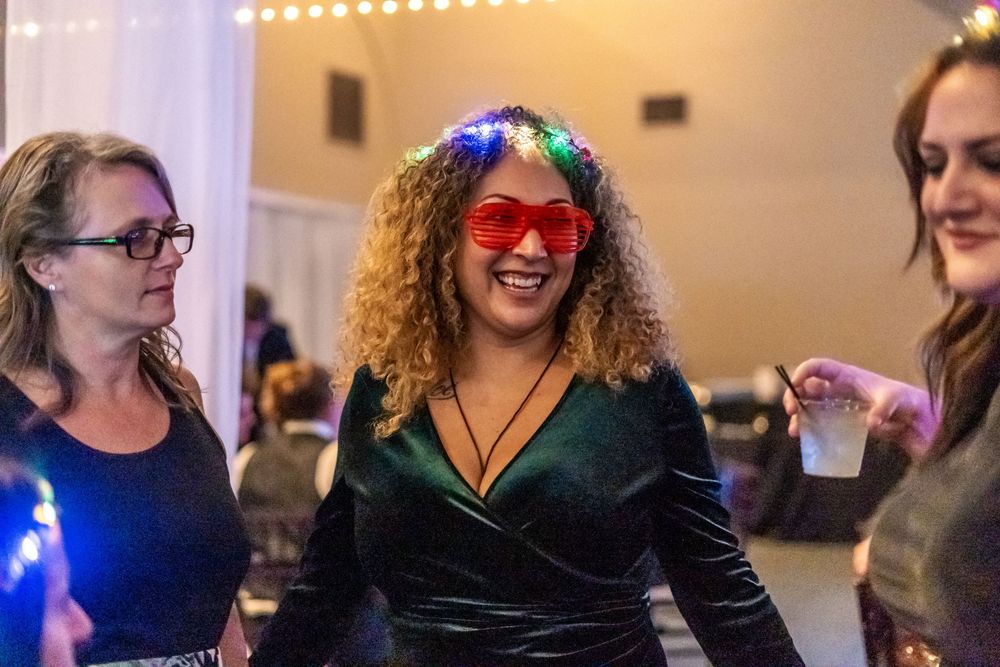 Channel Side Club in Palm Coast Florida. Wedding photography of fun wedding reception. People dancing at party.