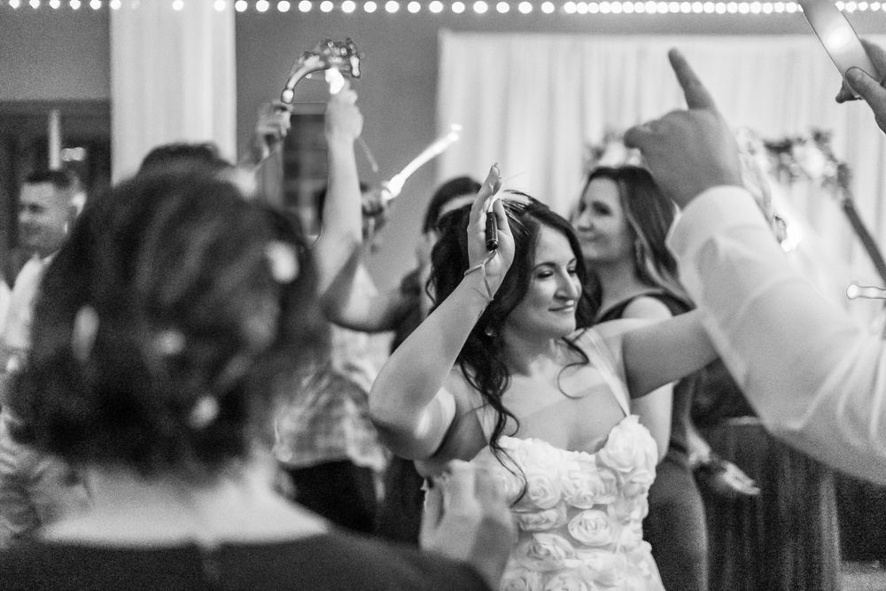 Channel Side Club in Palm Coast Florida. Wedding photography of fun wedding reception. People dancing at party.