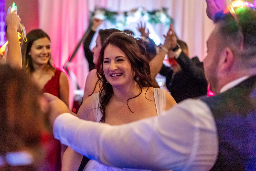 Channel Side Club in Palm Coast Florida. Wedding photography of fun wedding reception. People dancing at party.