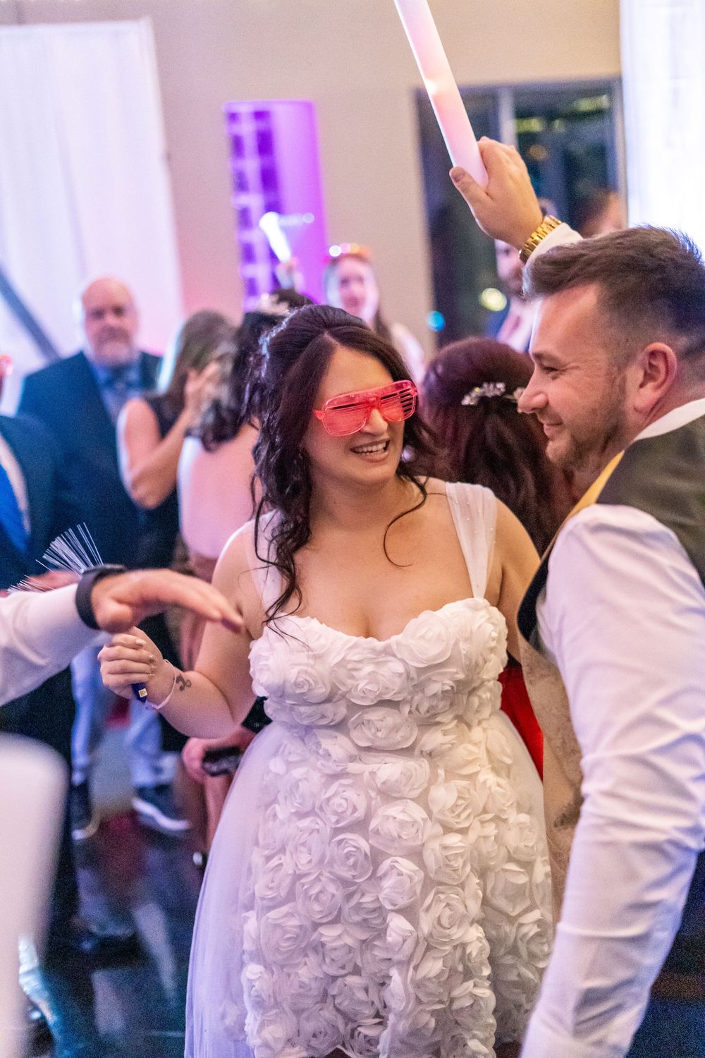 Channel Side Club in Palm Coast Florida. Wedding photography of fun wedding reception. People dancing at party.