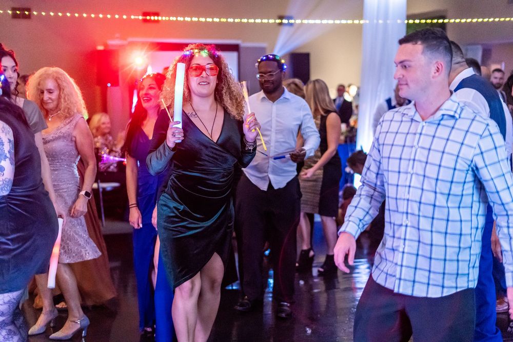 Channel Side Club in Palm Coast Florida. Wedding photography of fun wedding reception. People dancing at party.