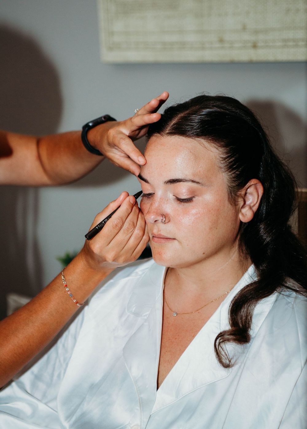 Bride getting bridal make-up in Sherwood,MI