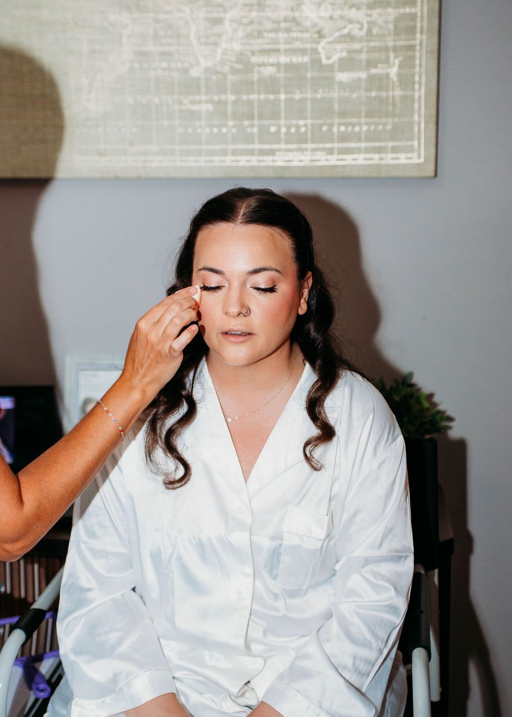 Bride getting bridal make-up in Sherwood,MI