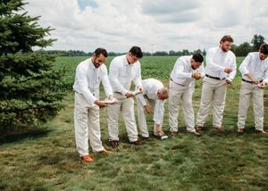 Groom and Groomsmen shotgunning beers in Sherwood,MI