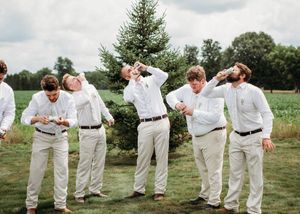 Groom and Groomsmen shotgunning beers in Sherwood,MI