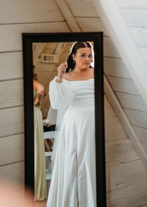 Bride looking in mirror during getting ready in Sherwood,MI