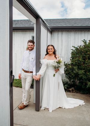 Bride and Groom smiling during First Touch before the ceremony in Sherwood,MI