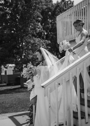 Bride walking down the steps approaching the ceremony in Sherwood,MI