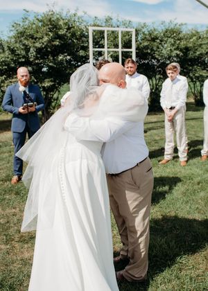 Bride and Dad hugging during ceremony in Sherwood,MI