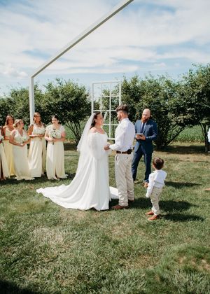 Bride, Groom and child during ceremony in Sherwood,MI