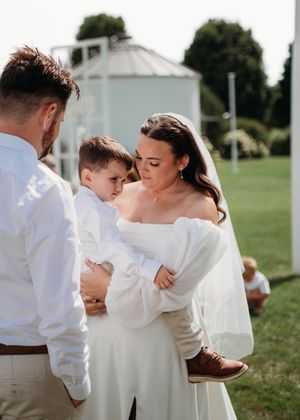 Bride, Groom and child during ceremony in Sherwood,MI