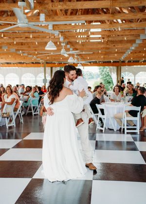 Bride and Groom with child during first dance in Sherwood,MI