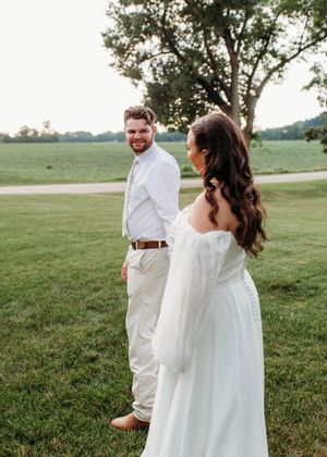 Groom looking at bride during sunset portraits in Sherwood,MI