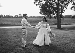 Black and white colored photo of Bride and Groom at sunset in Sherwood,MI