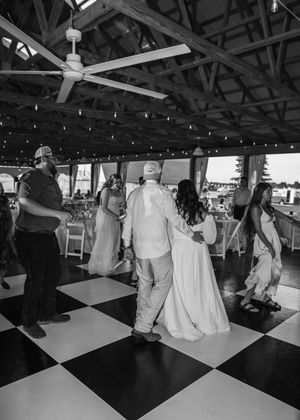 Groom embracing Bride on the dance floor in Sherwood, MI