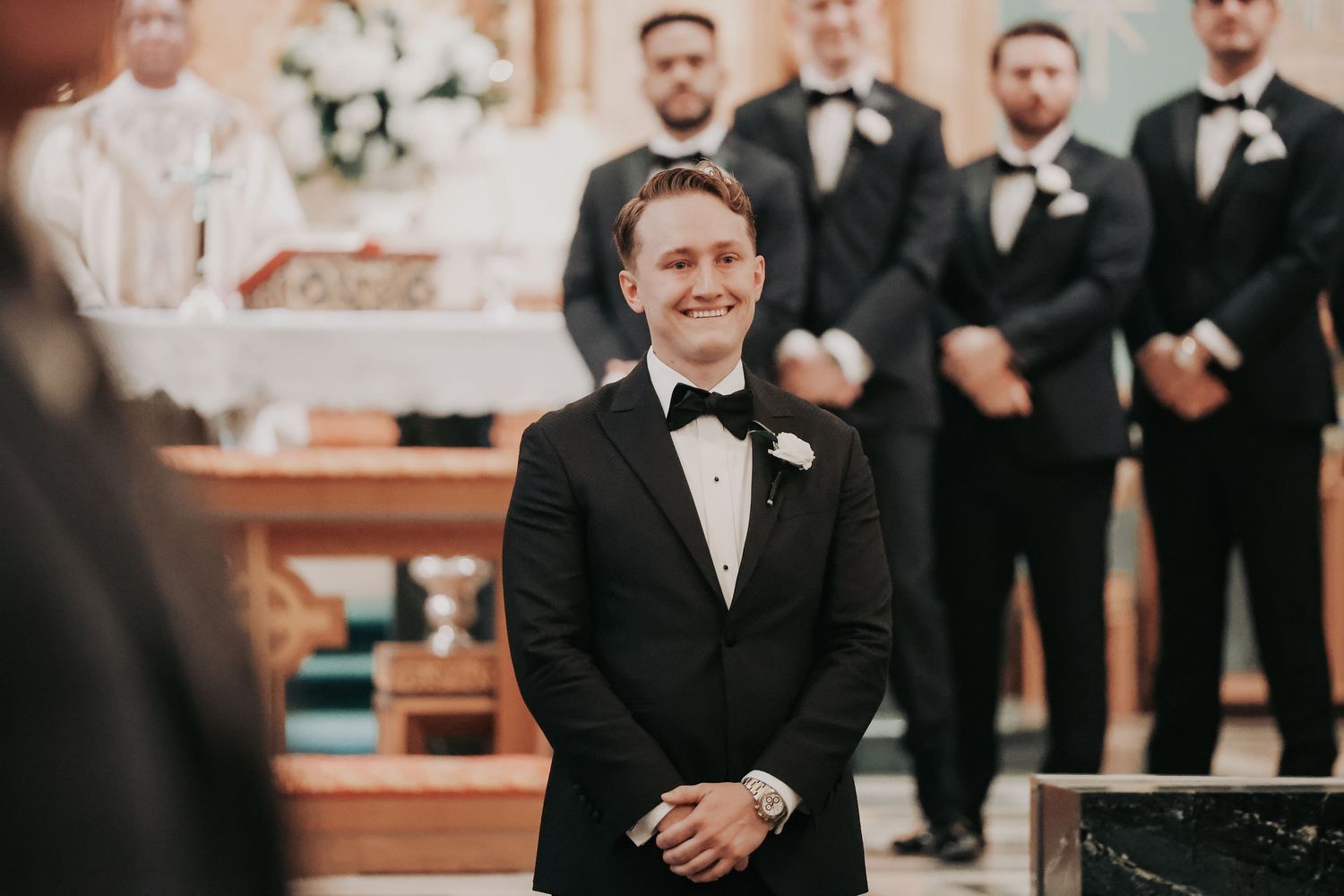 Bride walking toward Payton at Christ the King Catholic Church