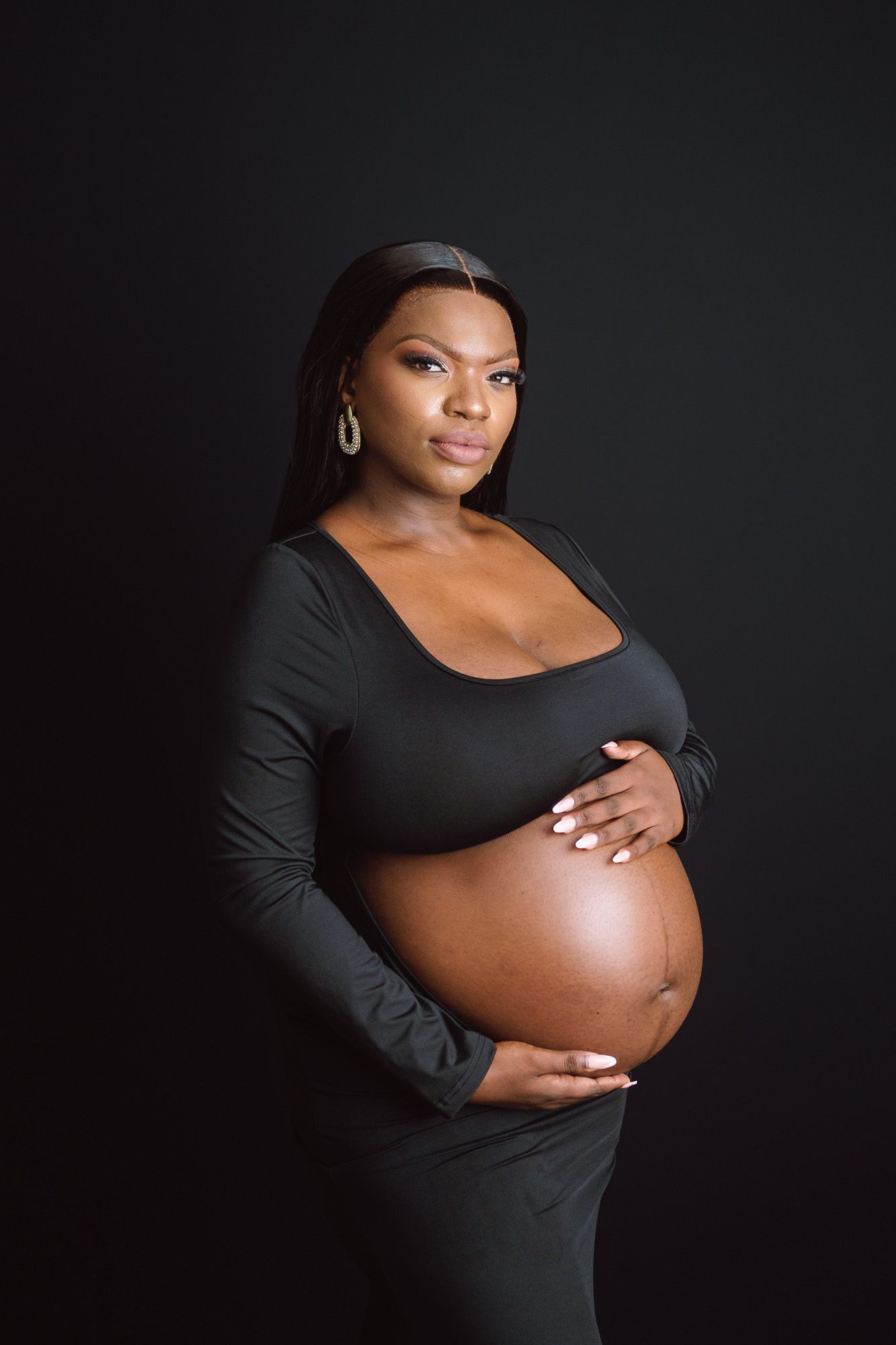 Studio maternity portrait celebrating the journey of becoming a mother