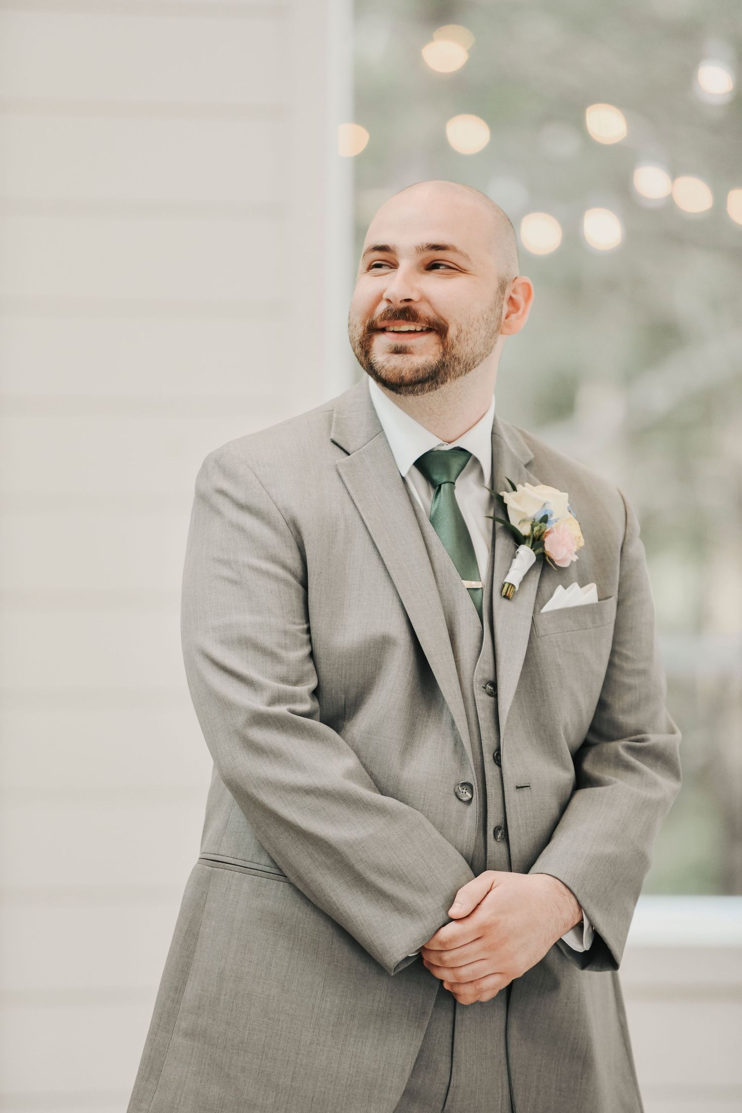 Groom watching his bride walk down the aisle at The French Farmhouse