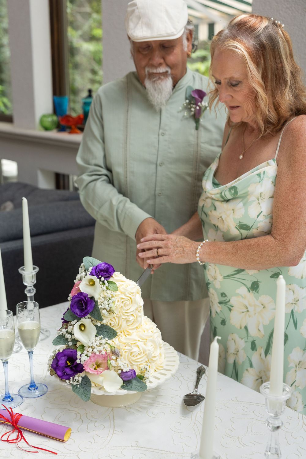 Karen and George cutting their wedding cake after their micro wedding in Luray, Virginia